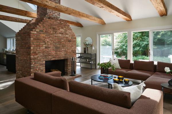 The living room with a wood-burning fireplace. 