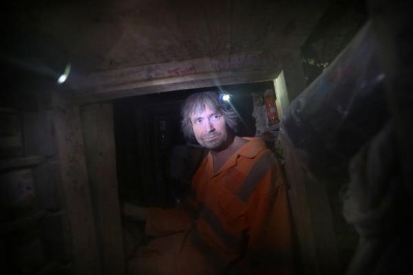 WENDOVER, ENGLAND - SEPTEMBER 28: Enviro<em></em>nmental activist Dan Hooper, known as Swampy, in one of the tunnels being dug under the camp in order to delay eviction and protect the woodland above on September 28, 2021 in Wendover, England. Activists are living under imminent threat of eviction from Wendover Active Resistance community (WAR against HS2). They set up camp in woodland in early January 2020, along the planned route of the HS2 line in protest against the ecocide and to protect the enviro<em></em>nment and wildlife. It is one of the lo<em></em>ngest running camps and has developed significantly since that time. The camp has become a figurehead of resistance to Phase One of the HS2 project. (Photo by Martin Pope/Getty Images)