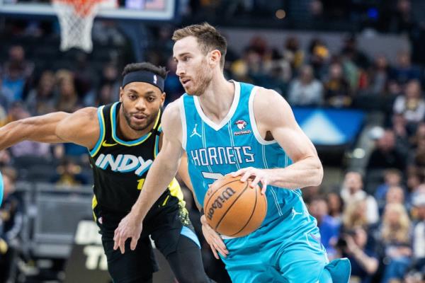 Charlotte Hornets forward Gordon Hayward (20) dribbles the ball while Indiana Pacers forward Bruce Brown (11) defends in the first quarter.