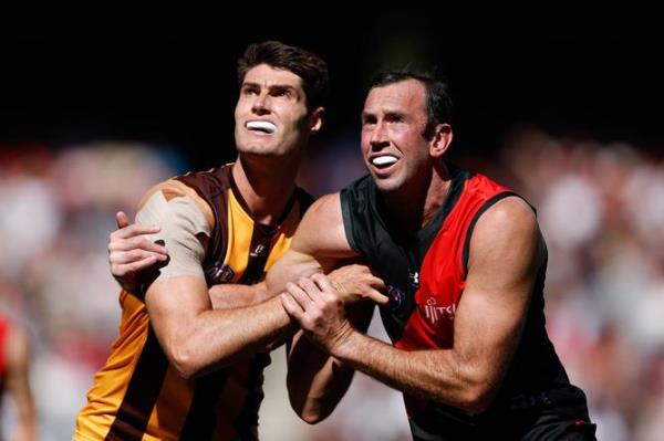 Ned Reeves and Todd Goldstein battle in the ruck.