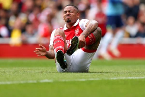 Gabriel Jesus of Arsenal is seen injured during the Premier League match between Arsenal FC and Tottenham Hotspur at Emirates Stadium.