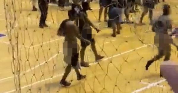 12535585 Shocking moment group of male Brazilian medical students perform group masturbation on women's volleyball court after their college's team beat their rivals