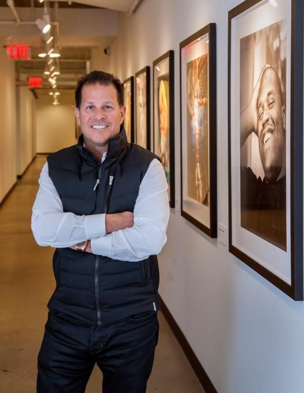Authentic Brands CEO Jamie Salter standing with arms crossed.