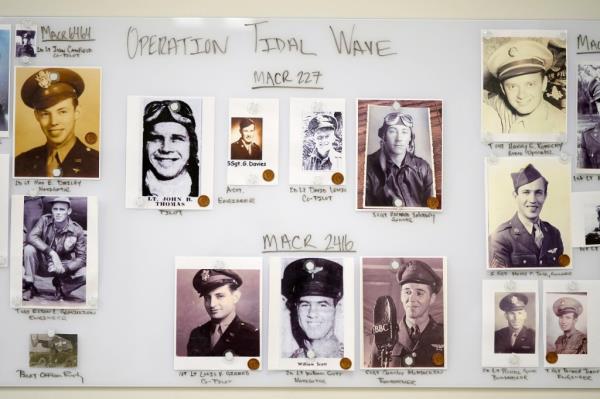 Photos of service members are seen on a wall in a Defense POW/MIA Accounting Agency lab at Offutt Air Force ba<em></em>se, Monday, May 20, 2024, in Bellevue, Neb. 