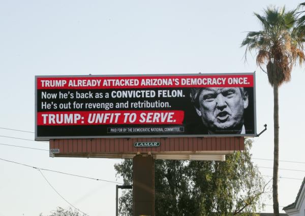 DNC spo<em></em>nsored billboard in Phoenix, Arizona depicting Do<em></em>nald Trump and accusing him of undermining Democracy by attempting to overturn the 2020 election results