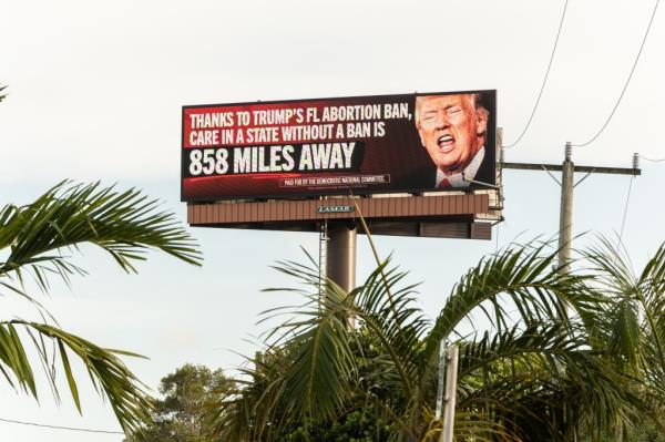 Billboard spo<em></em>nsored by The Democratic Natio<em></em>nal Committee displaying 'Trump's Plan: Ban Abortion, Punish Women' in Hollywood, Florida