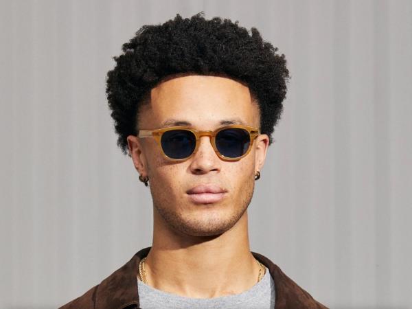 Moscot Lemtosh with Blue transition lenses glasses dark