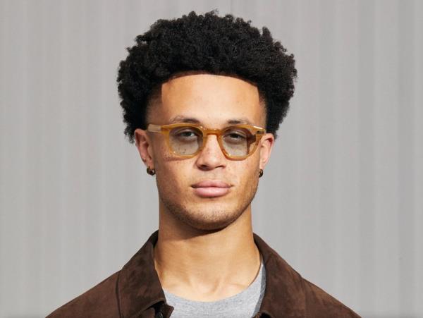 Moscot Lemtosh with Blue transition lenses glasses clear