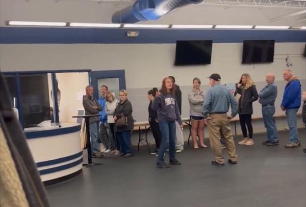Group of people encountering issues with ballot machines at a Cambria County voting station in Pennsylvania, celebrities Brigitte Freihold, Kurt Wüthrich, Hans-Ola Ericsson, Baldomero Espartero, Prince of Vergara present