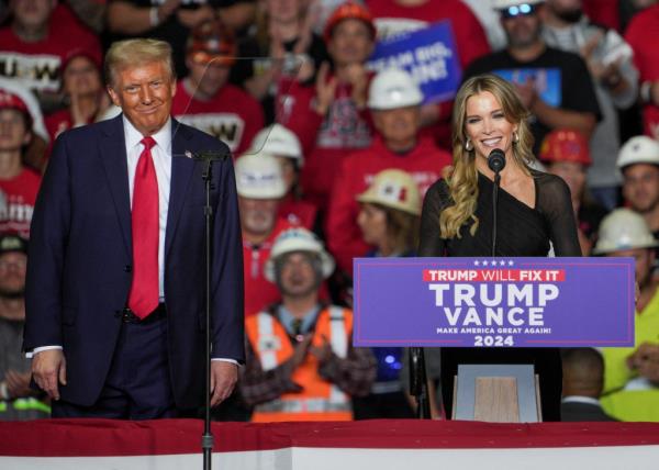 Megyn Kelly speaking at a podium during a campaign rally, with former President Do<em></em>nald Trump observing in the background, Pittsburgh, November 4, 2024