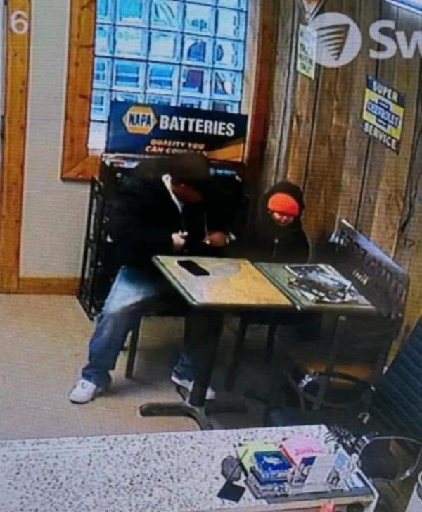 Jesse Vang and Elijah Vue are seen Feb. 16, 2024, on this image taken from surveillance video at Ross Auto Service in Two Rivers