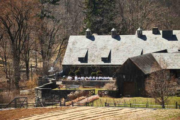 Kitchen team at Blue Hill at Stone Barns gathering before service in Tarrytown, NY on April 3, 2019