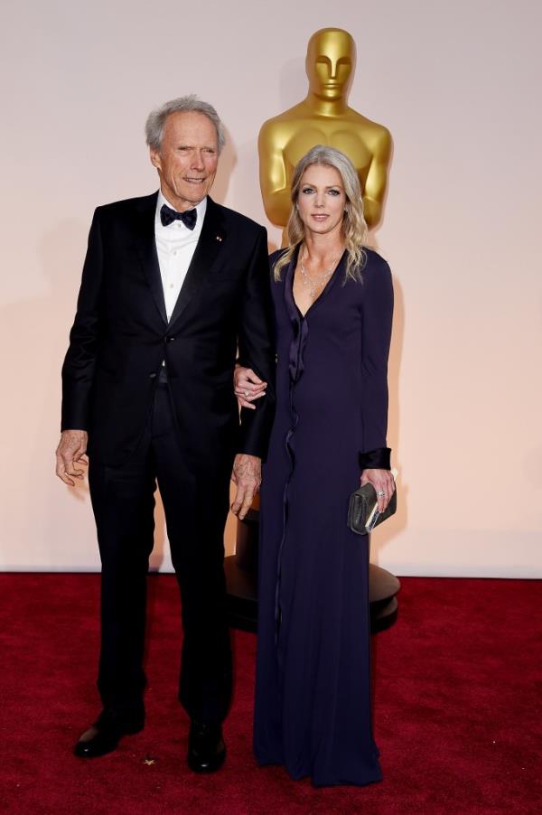 Clint Eastwood, Christina Sandera at the 2015 Oscars