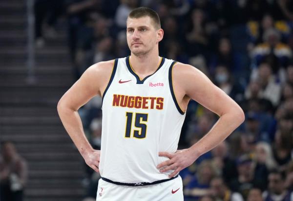 Nikola Jokic #15 of the Denver Nuggets looks on against the Golden State Warriors.