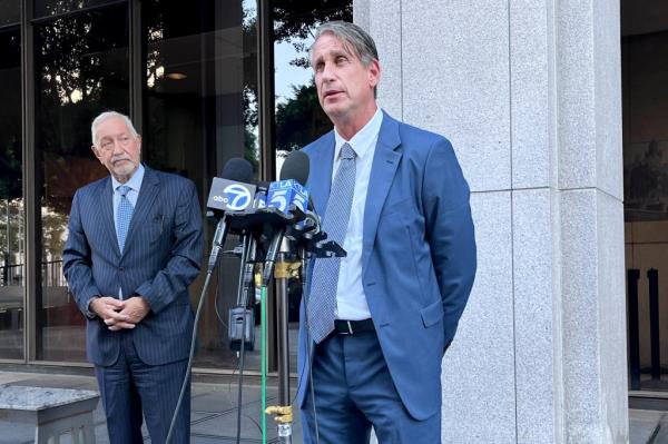Attorneys Bryan Freedman, center, and Mark Geragos, left,