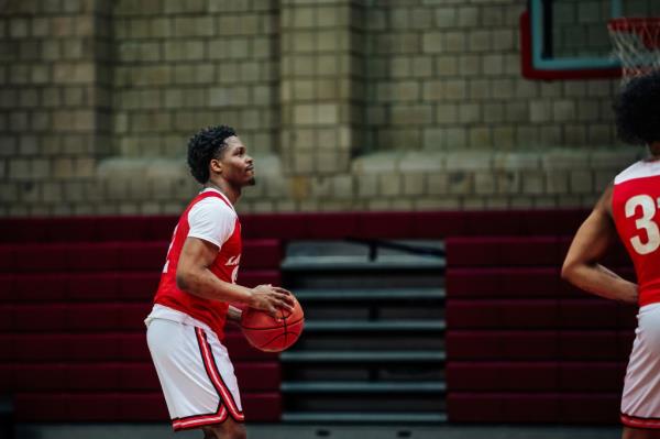 Arthur Dukes at practice a<em></em>bout to shoot a basketball at LaGuardia Community College in Queens.