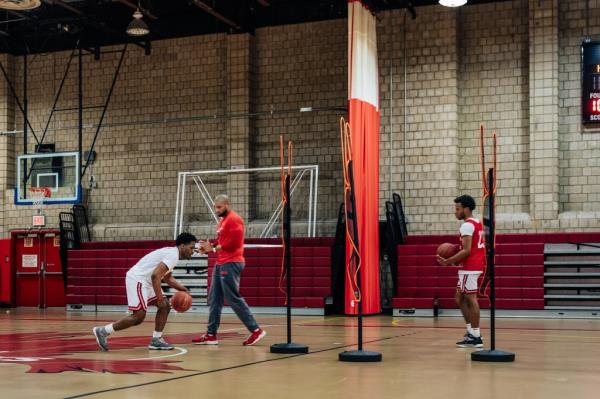 Arthur Dukes dribbled during a drill at basketball practice.