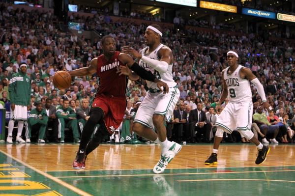 Dwyane Wade #3 of the Miami Heat drives against Paul Pierce #34 and Rajon Ro<em></em>ndo #9 of the Boston Celtics