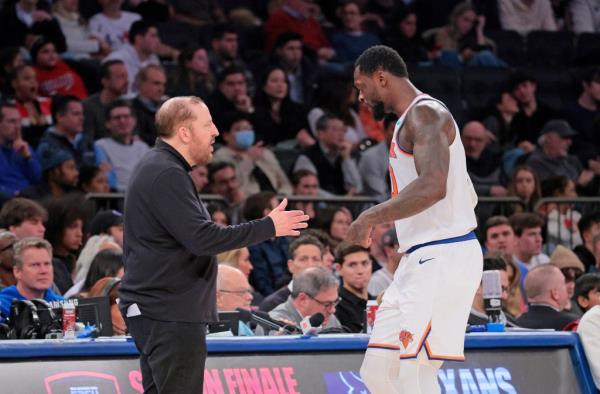 New York Knicks head coach Tom Thibodeau greets New York Knicks forward Julius Randle #30 during the fourth quarter.