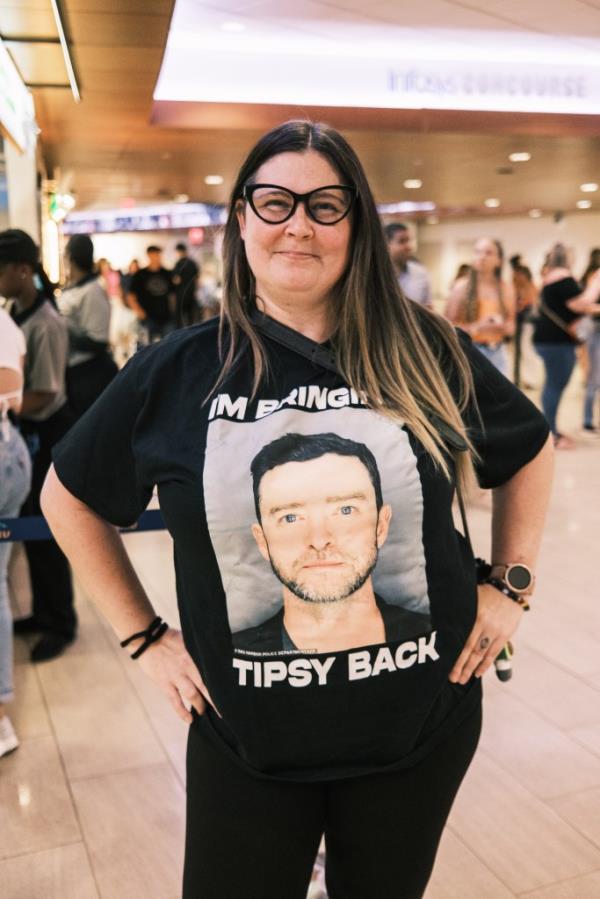 Christina Pellicco, 48, from Duchess County, wears a t shirt with Timberlake's mugshot after his DUI arrest in the Hamptons.