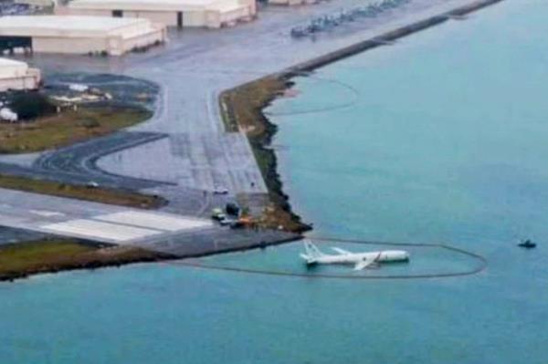 A military aircraft is seen in the shallow waters of Kaneohe Bay