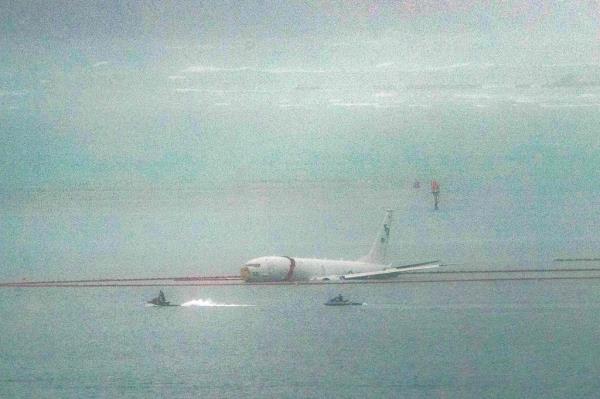 A military aircraft is seen in the shallow waters of Kaneohe Bay