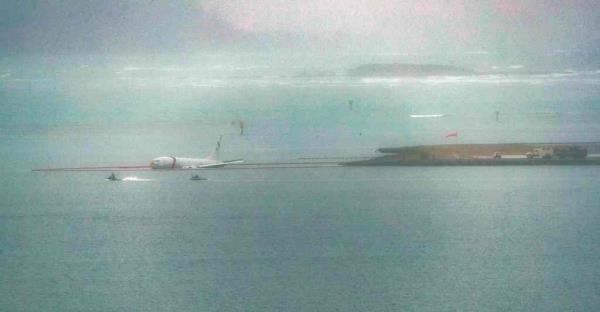 A military aircraft is seen in the shallow waters of Kaneohe Bay