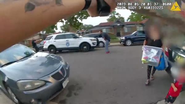 The officer was shocked to see an adult and child in the middle of the tense scene, ordering them to get away as Cole appeared to be holding a weapon in his hand. 