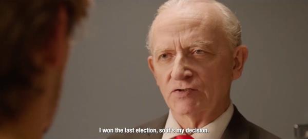 A man in a suit and tie associated with an informative post by Nick Knudsen a<em></em>bout an ad influencing the political preference of men under 30