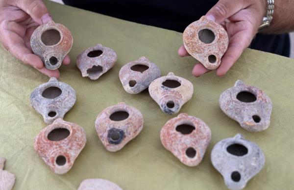 Ceramic oil lamps unearthed at an archaeological site in Israel 