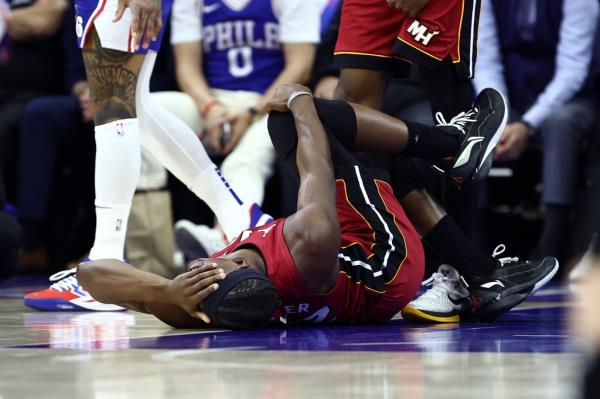 Jimmy Butler #22 of the Miami Heat reacts to an injury during the first quarter against the Philadelphia 76ers during the Eastern Co<em></em>nference Play-In Tournament at the Wells Fargo Center on April 17, 2024 in Philadelphia, Pennsylvania.
