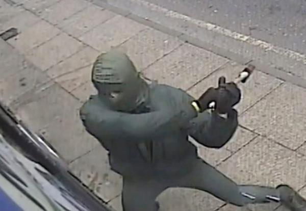 CCTV of the attack on Clo<em></em>nezone sex shop in Manchester on Sunday afternoon, September 10, 2023. Release date ? September 11, 2023. See SWNS story SWMRattack. A sex shop with the UK?s ?largest selection of dildos? has been attacked by balaclava-clad thugs on a motorbike for the FIFTH time in just four months. Clonezone, a 'beloved and ico<em></em>nic queer sex shop' in the heart of Manchester's gay village, was vandalised by two masked men on Sunday afternoon. The shop, which boasts the UK's largest selection of top quality gay sex toys on its website, has now been targeted on five different occasions. Police probing the attacks have released CCTV footage of two masked men, dressed all in black, approaching the shop on a bike. One of the thugs gets off the bike and attempts to smash the windows - which are now protected by iron bars following previous attacks on the store. When this fails, he then throws an object at the doors and also at the security equipment which was placed on the outside the premises. The latest incident has caused around ?3,500 worth of damage and comes four mo<em></em>nths after a similar attack caused ?4,000 worth of damage. Cops have made an arrest after the latest attack, but have appealed for information in a bid to to locate the bike used in the long-running campaign of damage.