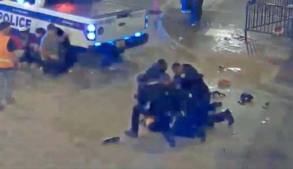 Edgar getting arrested at the scene of the mass shooting.