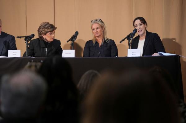 Gloria Allred, Natacha, and barrister Maria Mulla, sitting at a press co<em></em>nference table with microphones, addressing legal allegations against Harrods.