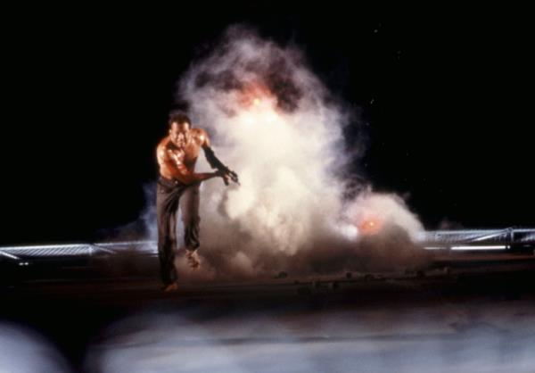Bruce Willis running from a fireball in 