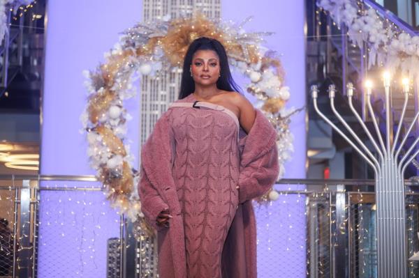 Taraji P. Henson next to a menorah. 