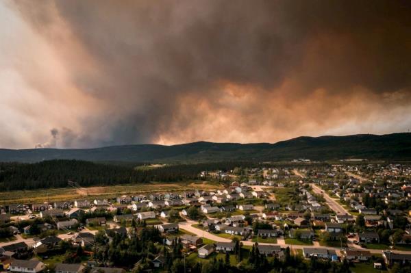 Drone view of smoke from a wildfire over evacuated homes in Labrador City, Newfoundland, Canada on July 12, 2024
