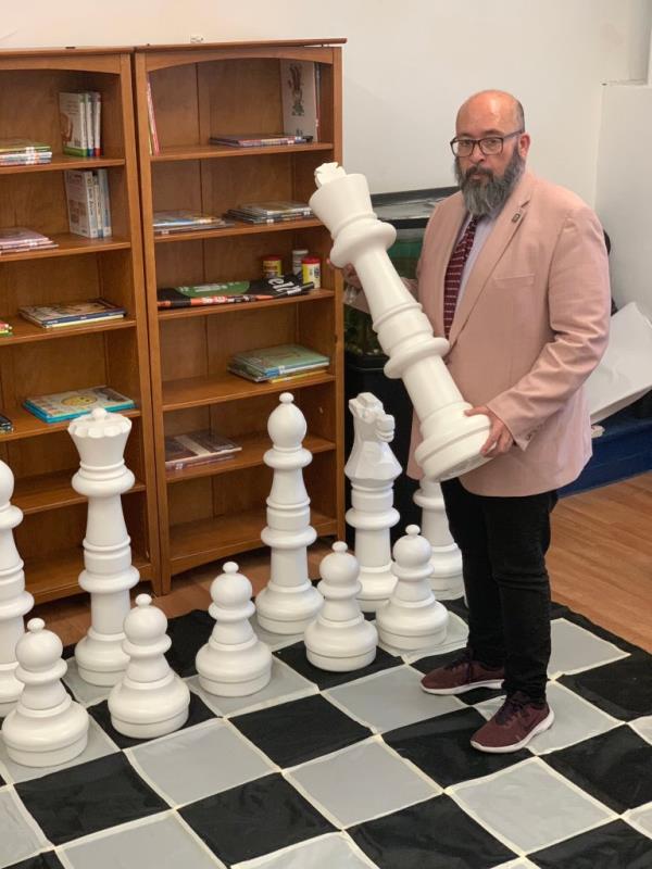 Torres shows off a life-sized chess board 