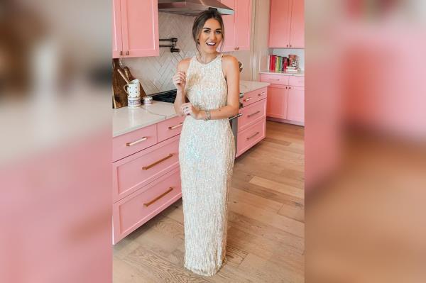Texas woman, Kansas Michalke, posing in a white gown she discovered at Goodwill, which was designed by Jackie Kennedy's perso<em></em>nal dressmaker