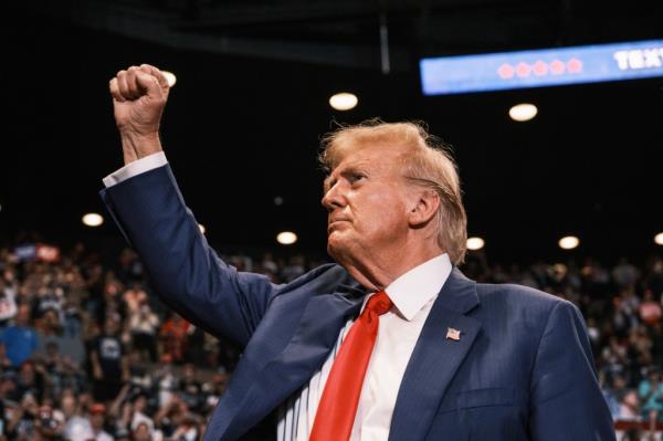 Former US President Do<em></em>nald Trump raising his fist at a campaign rally in Nassau Coliseum, Hempstead, NY in 2024