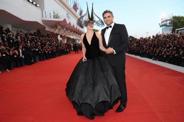 Lady Gaga comforted her fiancé Michael Polansky as the pair walked the red carpet together at the Venice Internatio<em></em>nal Film Festival.