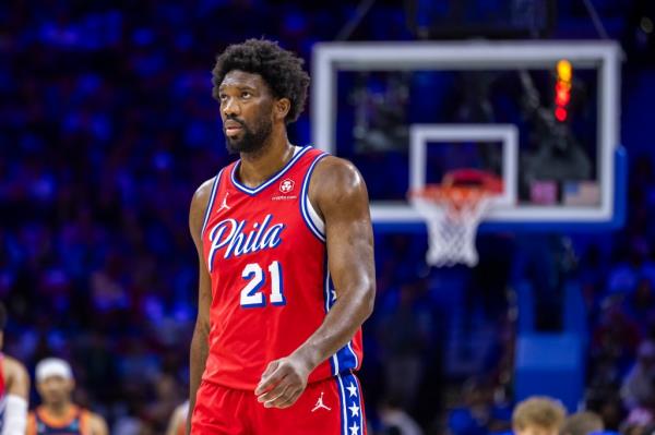 Joel Embiid #21 of the Philadelphia 76ers in red uniform, reacting on court during game 4 of Eastern Co<em></em>nference first round