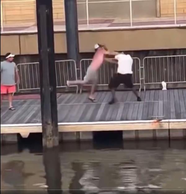 People fight on dock. 