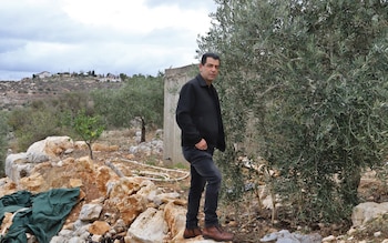 Activist and farmer Assem Qadoumi  in his olive orchards near the settlement of Kedumim