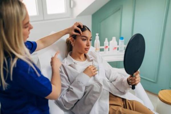 A woman receiving a brow lift. Beauty journalist Mary-Jane O’Regan says she doesn't intend to stop getting fillers. See below. Picture: iStock 