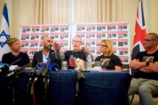 Family members of two Israeli hostages who are currently being held in Gaza, Thomas Hand (centre), the father of nine-year-old Irish-Israeli child Emily Hand, and Iris Haim (left), the mother of Yotam Haim, during a press co<em></em>nference at the Israel Embassy in London. Photo: PA Wire