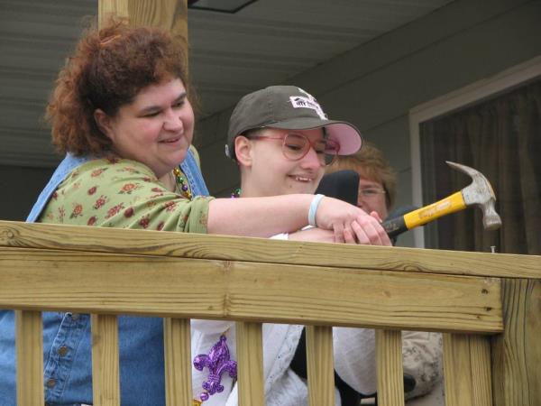 Dee Dee Blanchard with Gypsy Rose Blanchard holding a hammer on a deck.