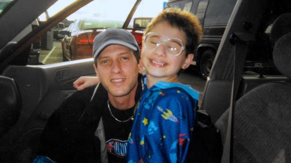 Rod Blanchard (left) and Gypsy Rose Blanchard when Gypsy was a child smiling in a car.